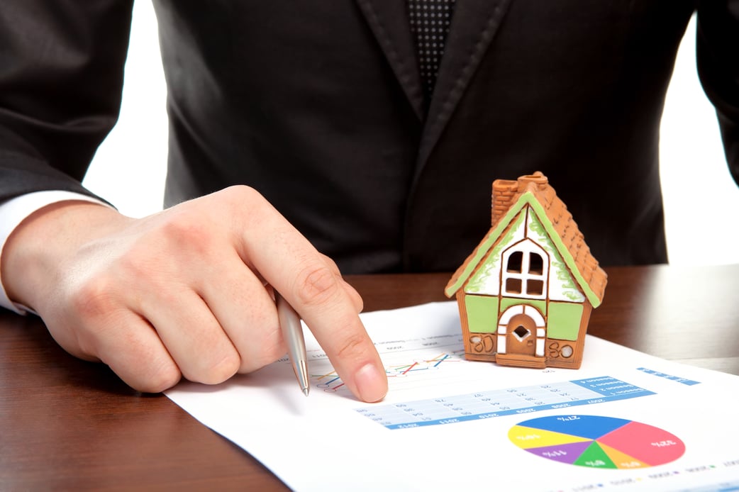 Businessman sitting at the table and sign a contract