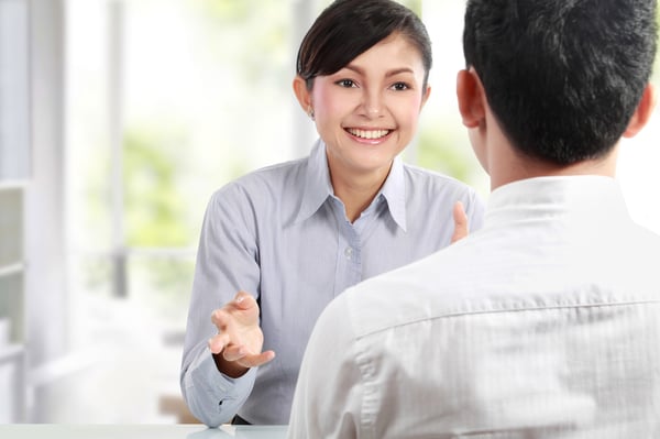 Two people talking in a business meeting