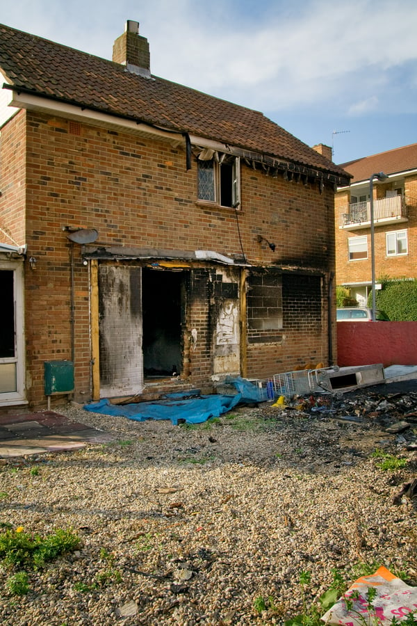 A brick house with fire damage