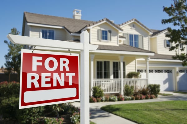 House with a "for rent" sign in  front