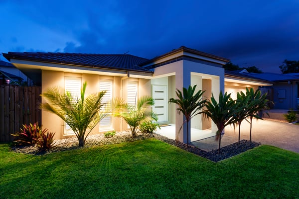 A well-lit home outside at night