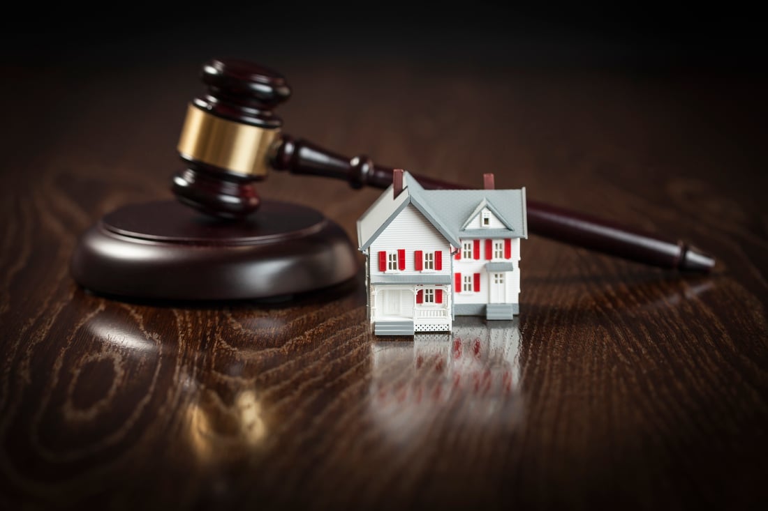 Gavel and Small Model House on Table-1