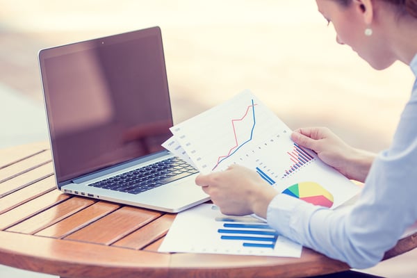 Hands with charts on papers